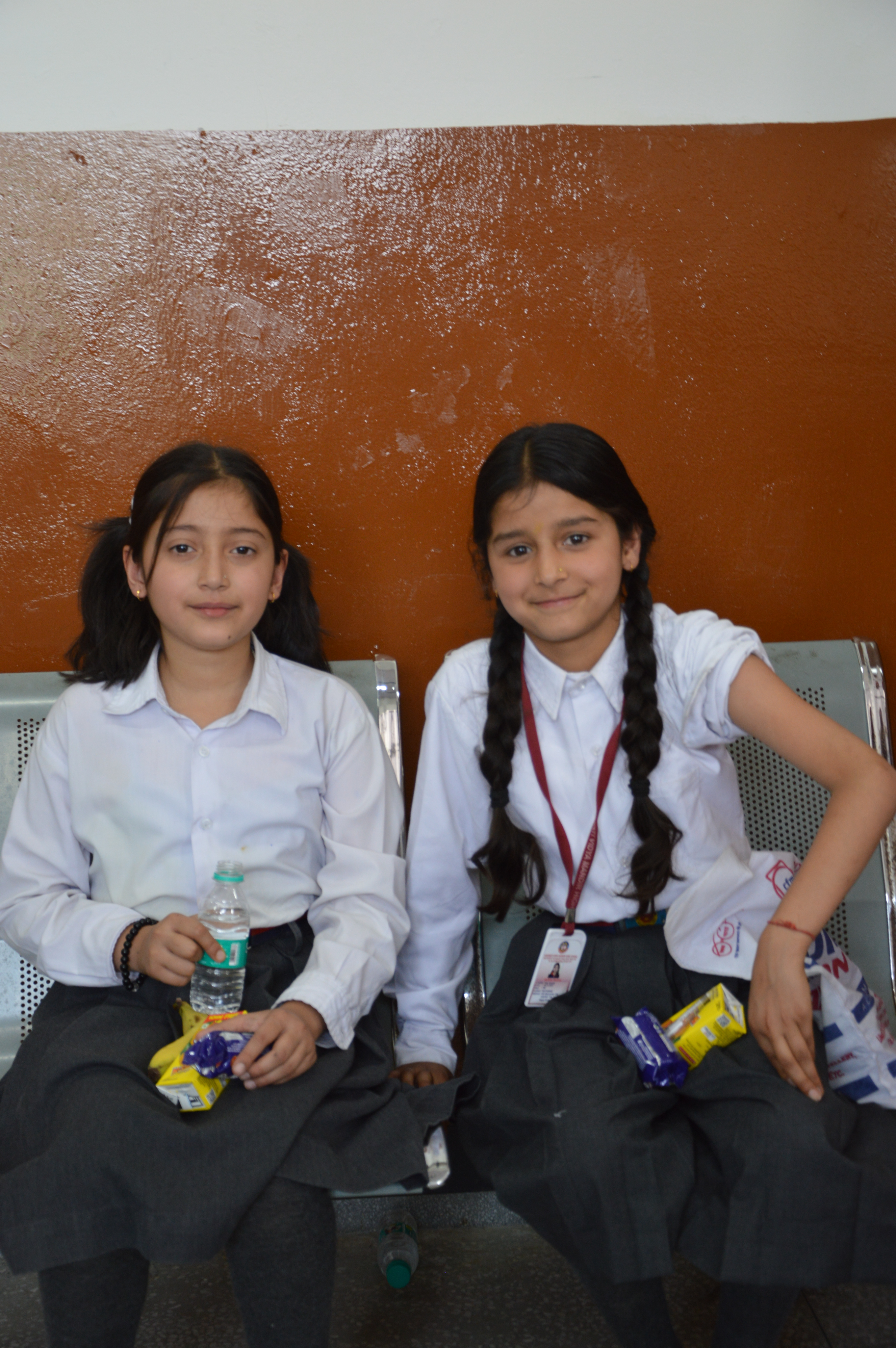 Two young girls smiling